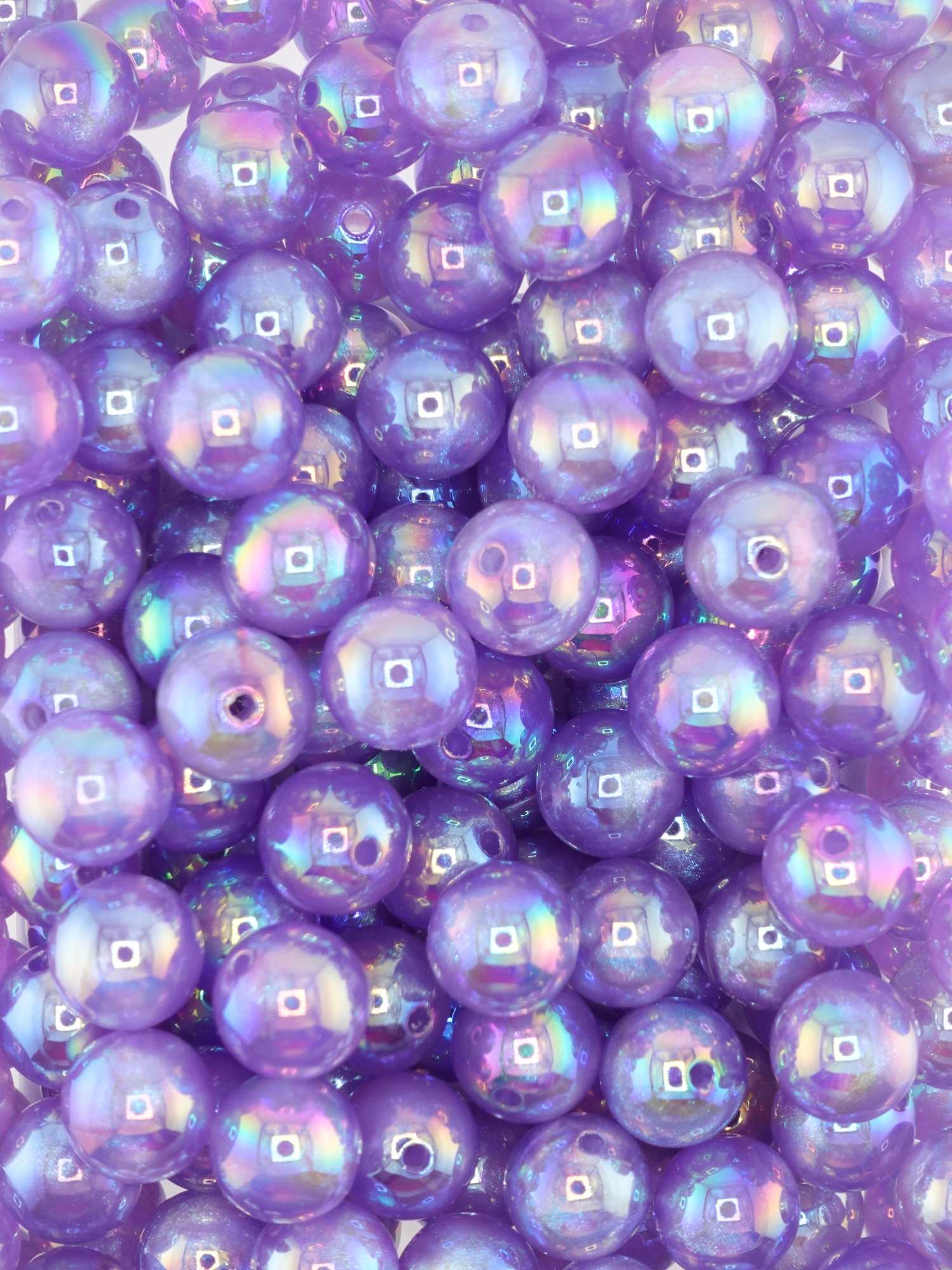 Collection of light purple colored beads with an aurora borealis shimmer
