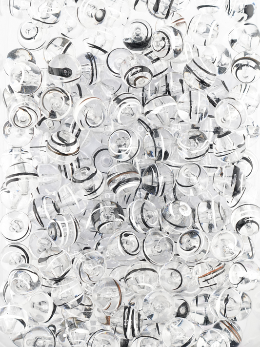 Collection of clear beads with a black & white paint stroke design