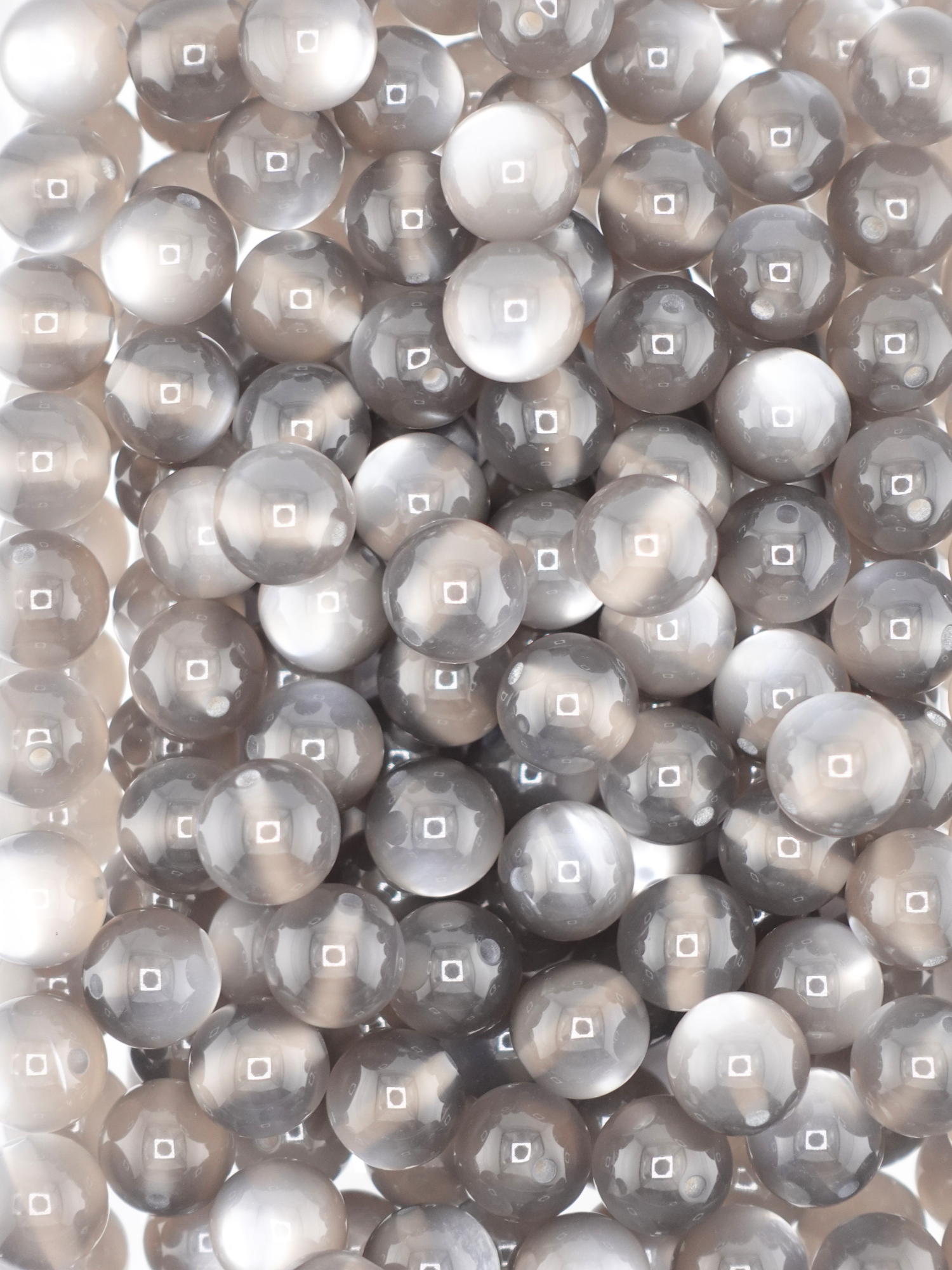 Collection of cat eye beads with a dark grey color