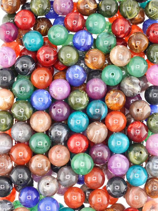Collection of dark colored swirl beads with a variety of colors: brown, red, blue, yellow, green, purple, orange.