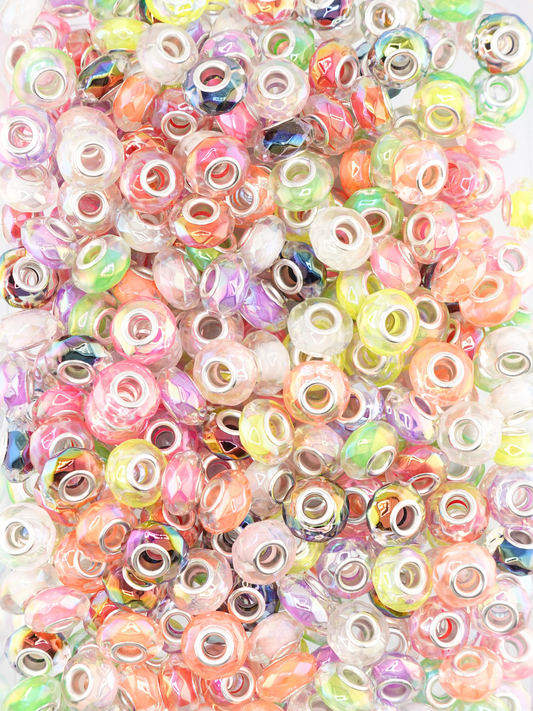 Collection of different colored clear spacers with a faceted texture