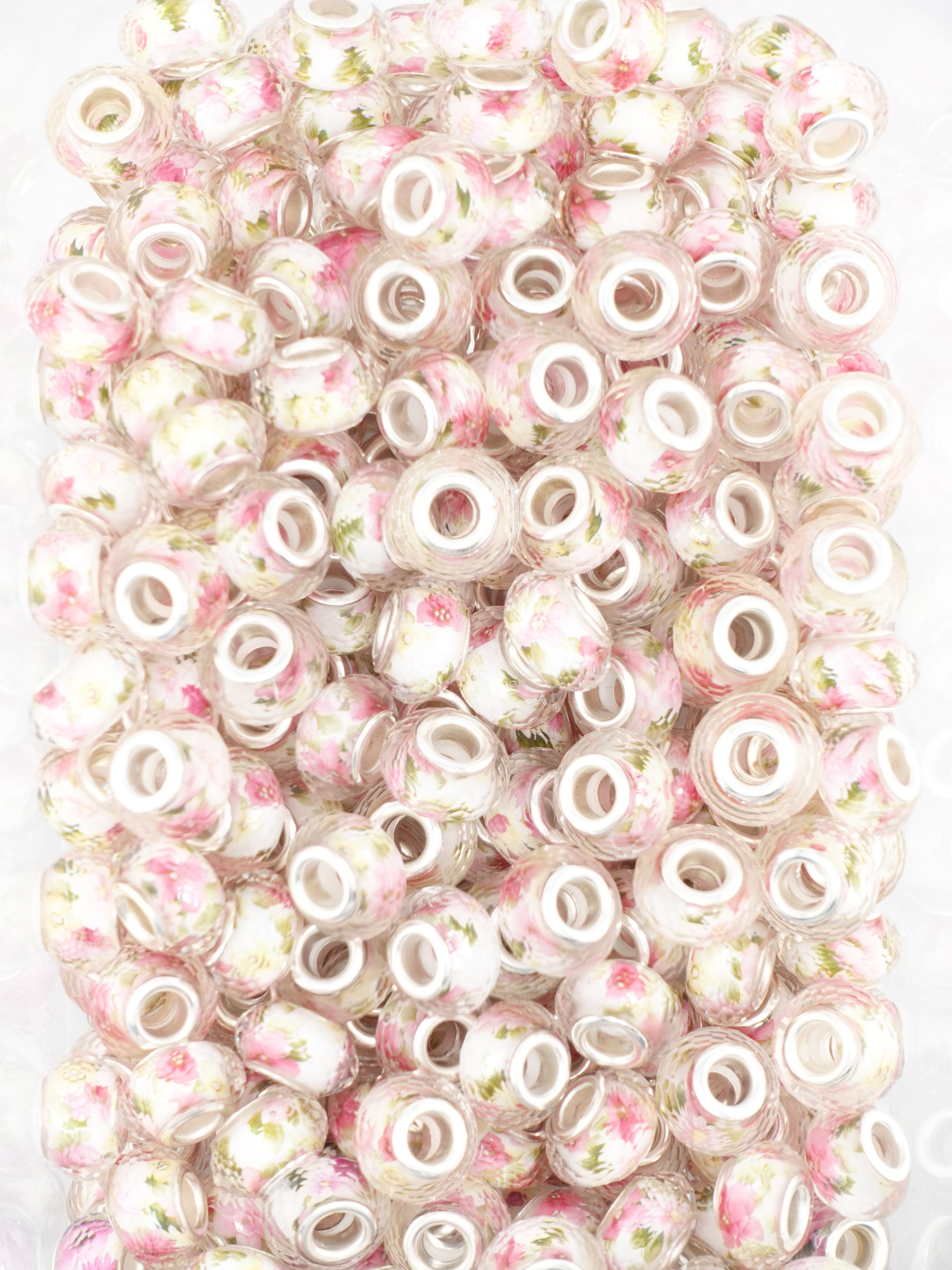 Collection of spacers with a pink floral design