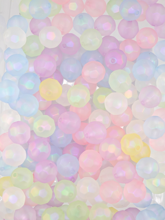 Collection of frosted disco beads with a mix of pastel colors; pink, yellow, green, white, and blue