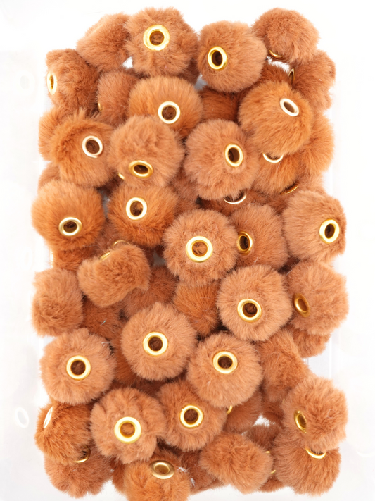 Collection of camel brown fuzzy pom pom spacers