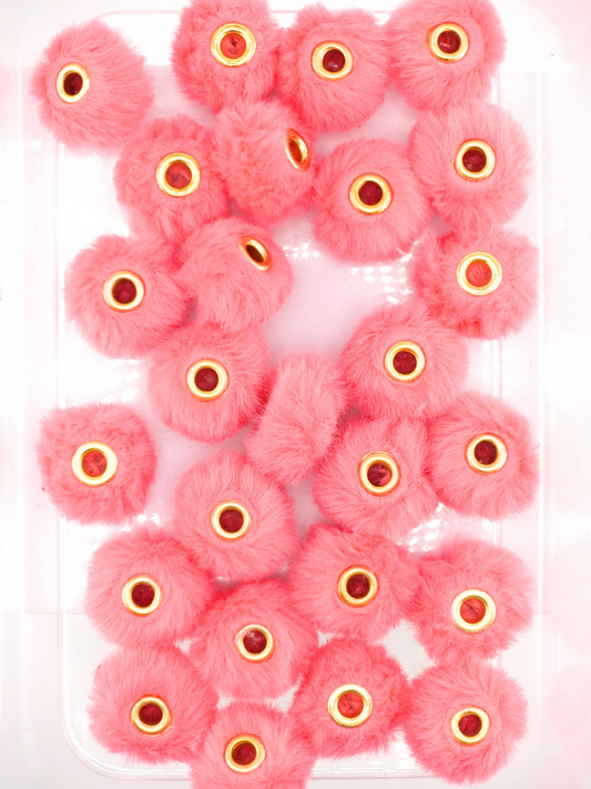 Collection of hot pink fuzzy pom pom spacers