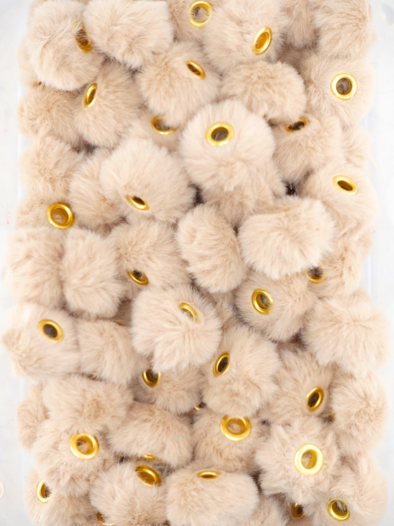 Collection of latte brown fuzzy pom pom spacers