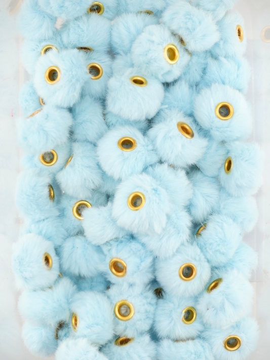 Collection of light blue fuzzy pom pom spacers