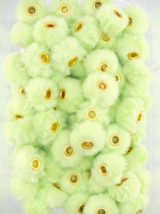 Collection of lime green fuzzy pom pom spacers