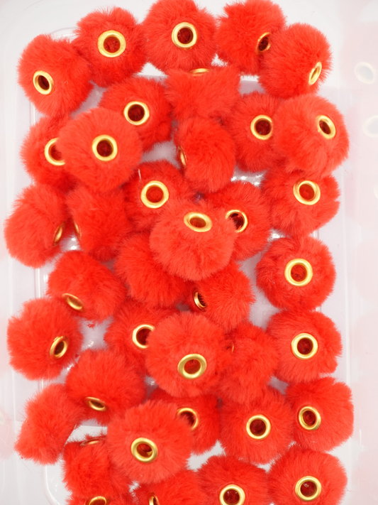 Collection of red fuzzy pom pom spacers