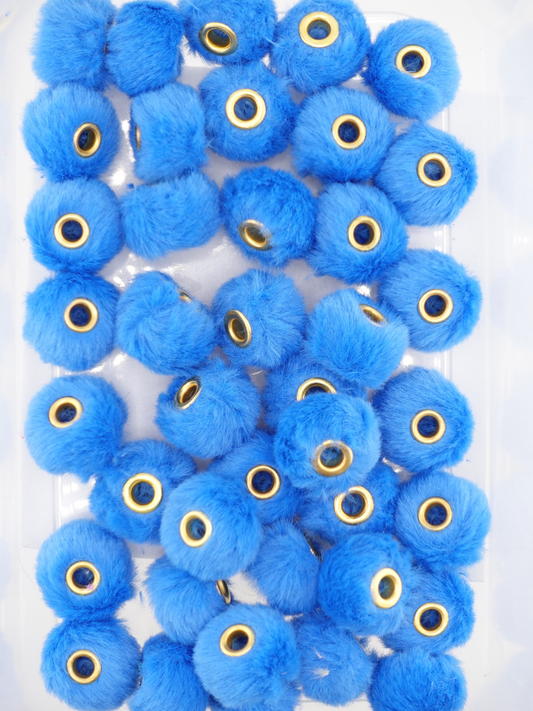 Collection of royal blue fuzzy pom pom spacers