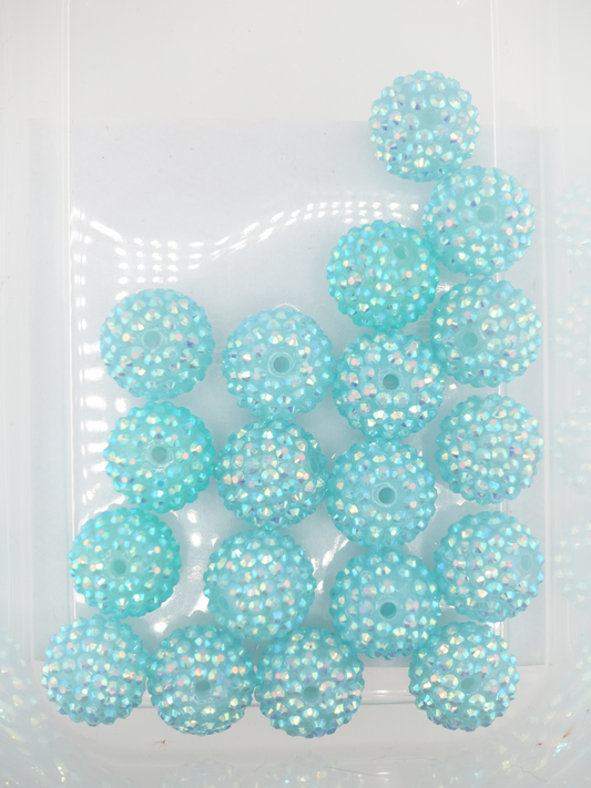 Collection of turquoise rhinestone beads with an aurora borealis finish