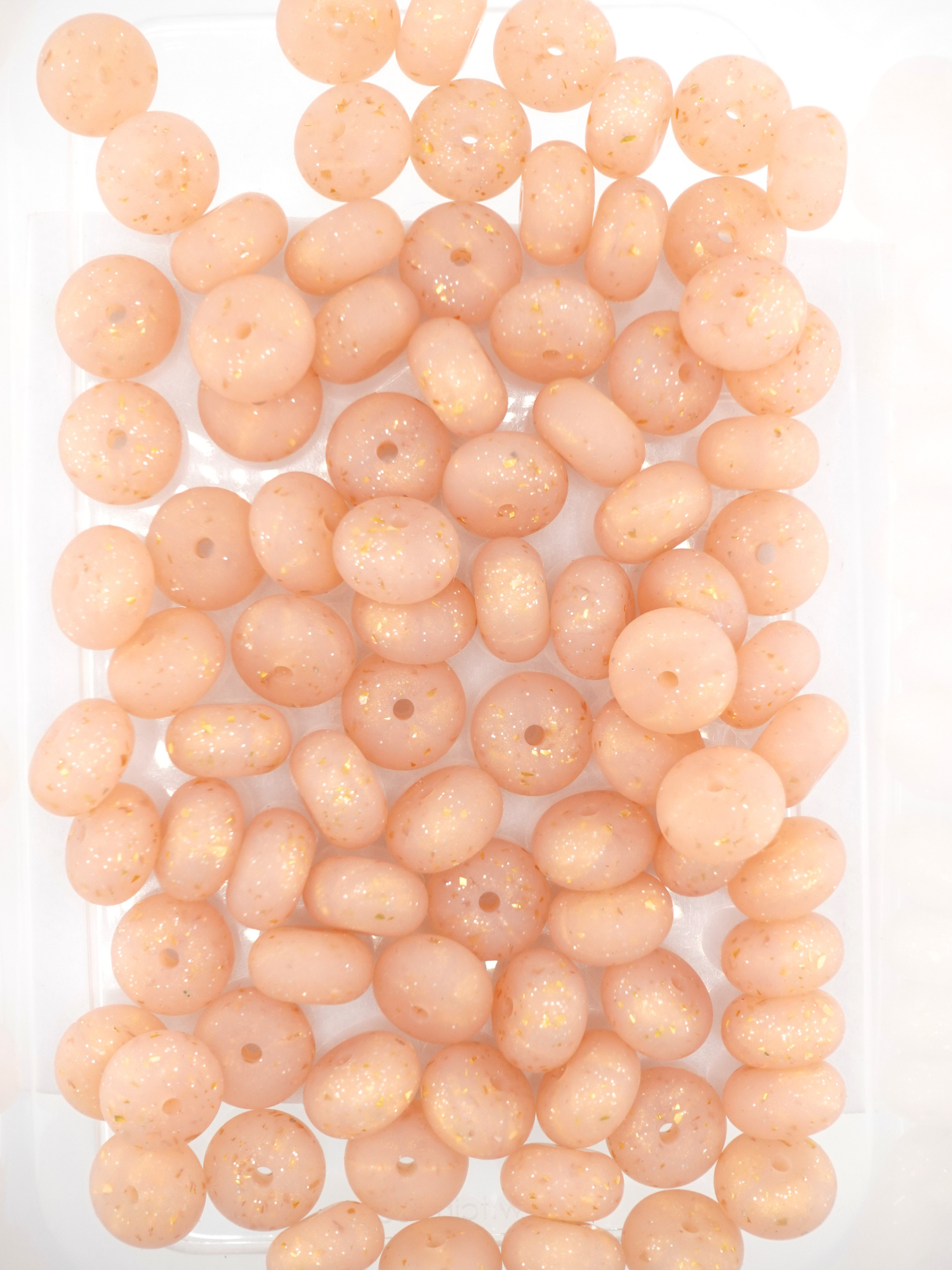 Collection of champagne colored silicone spacers with confetti design