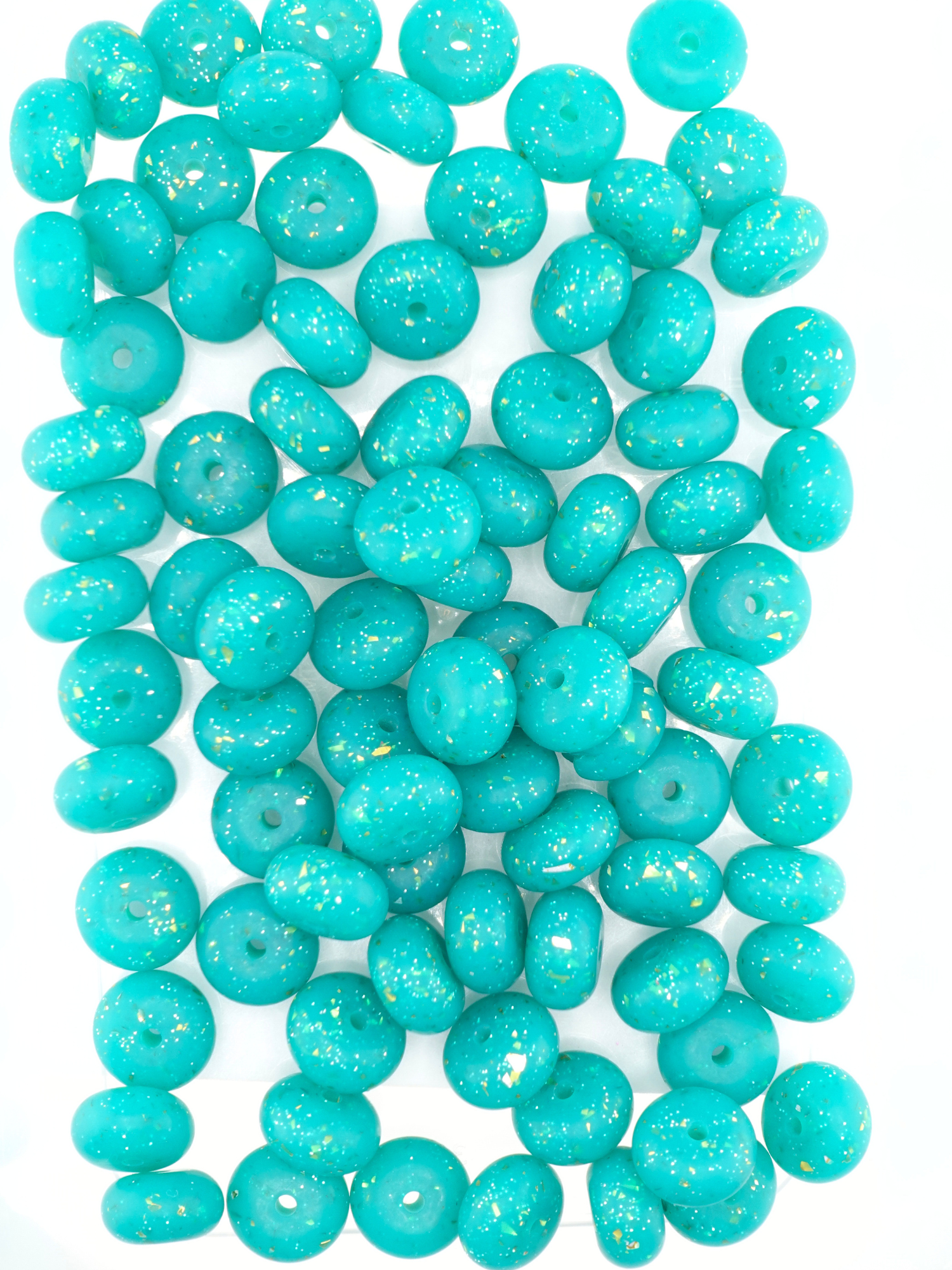 Collection of emerald green silicone spacers with confetti design