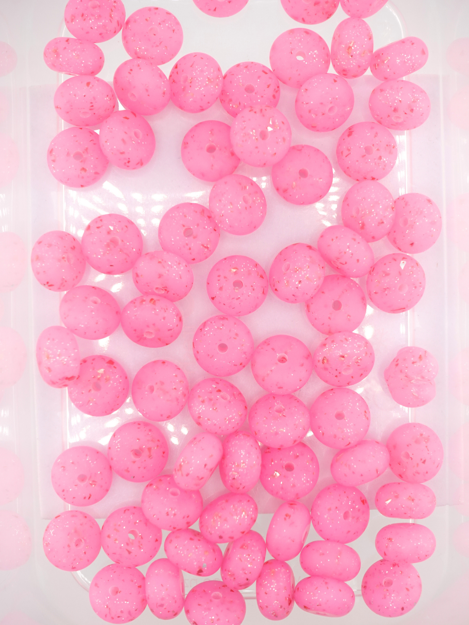 Collection of hot pink silicone spacers with confetti design