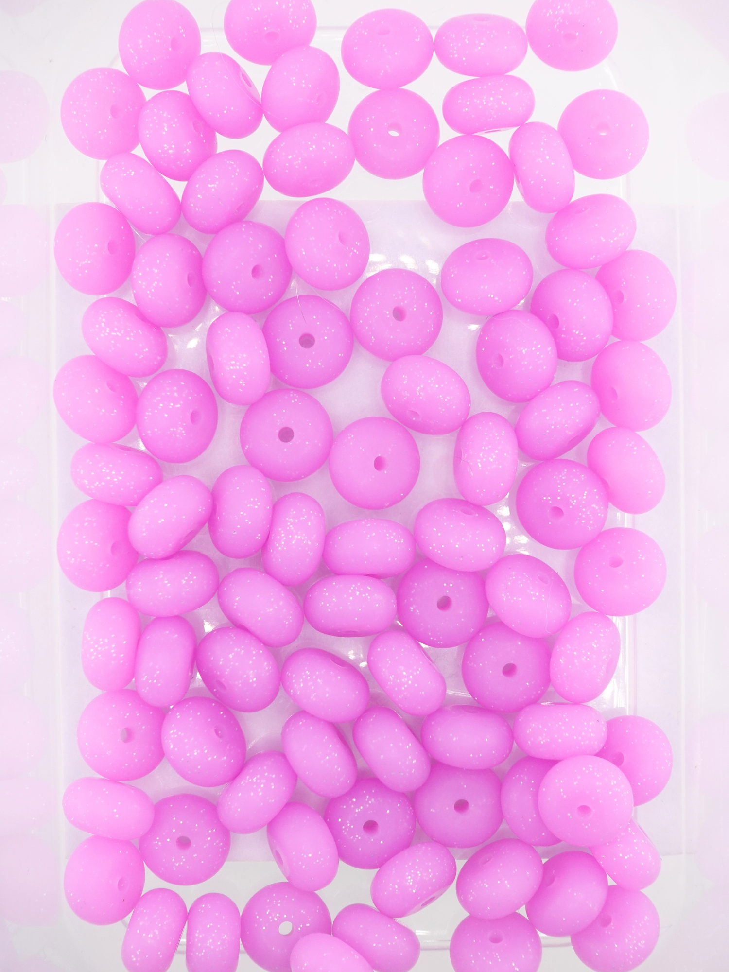 Collection of purple colored silicone spacers with glitter