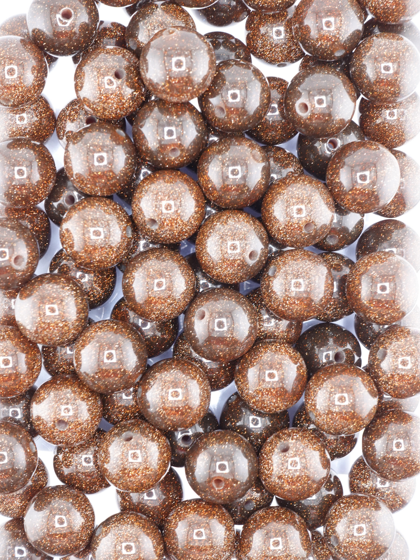 Collection of brown colored beads with a glitter finish