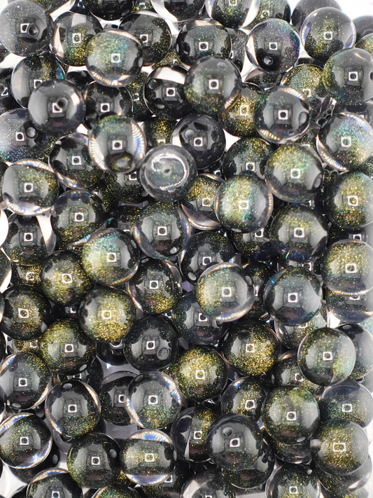 Collection of black colored gold glitter beads