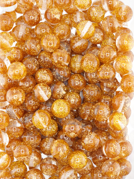 Collection of half glitter beads in a gold color