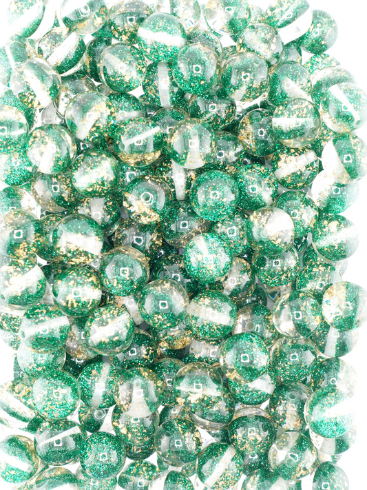 Collection of half glitter beads in green
