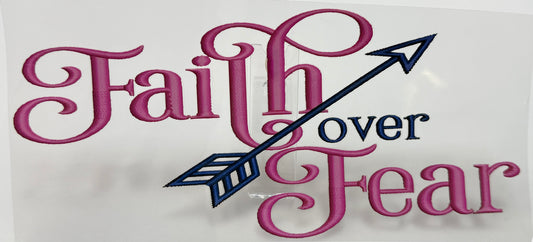 Decorative sign with 'Faith over Fear' text and an arrow 