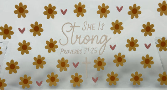 Decorative paper with floral pattern and 'She is Strong' text