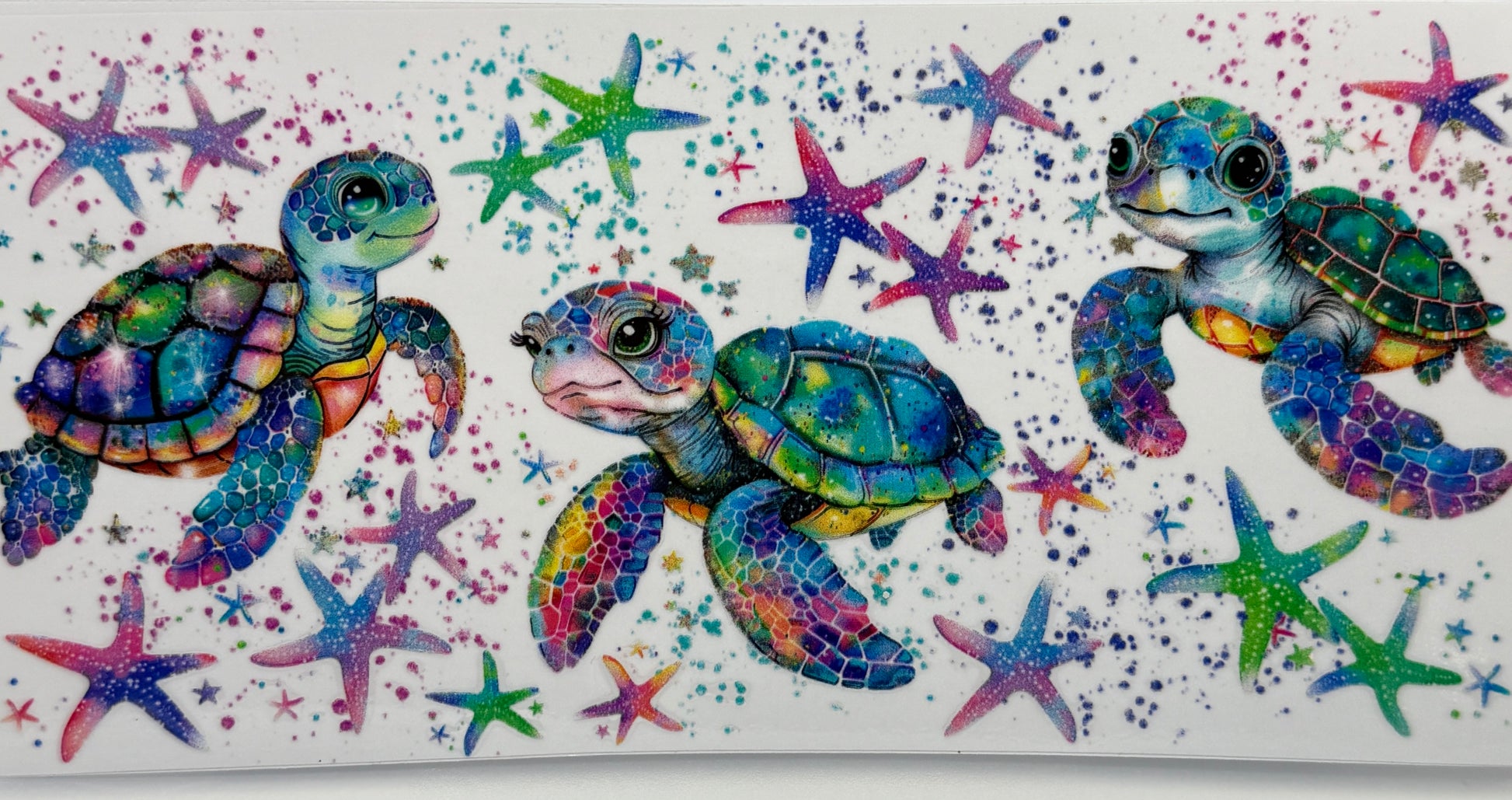 Colorful illustration of three turtles with starfish 