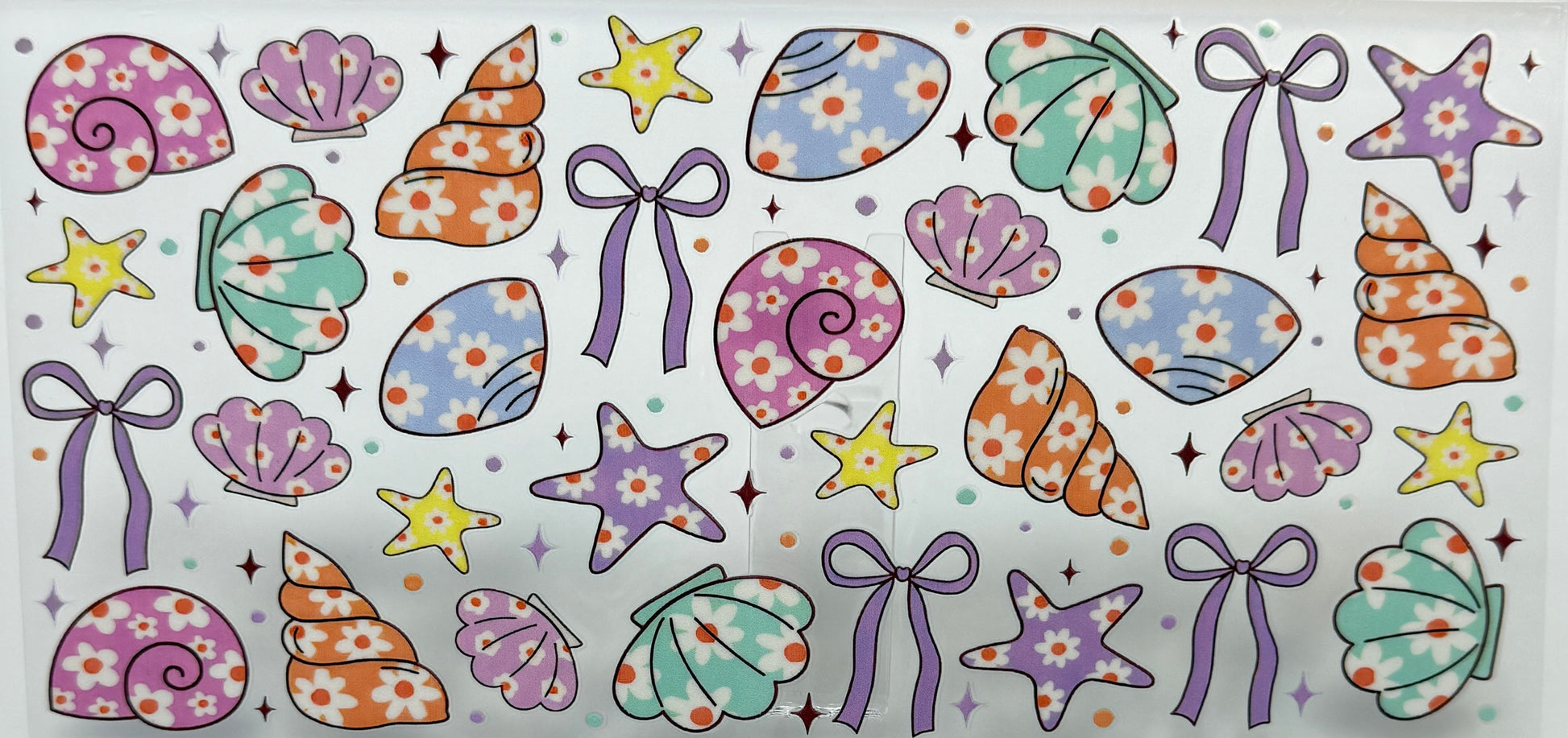Pattern of colorful shells, ribbons, and stars 