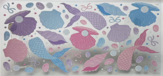 Decorative border with mermaid tails and shells 