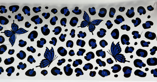Patterned fabric with blue butterflies and black leopard print 