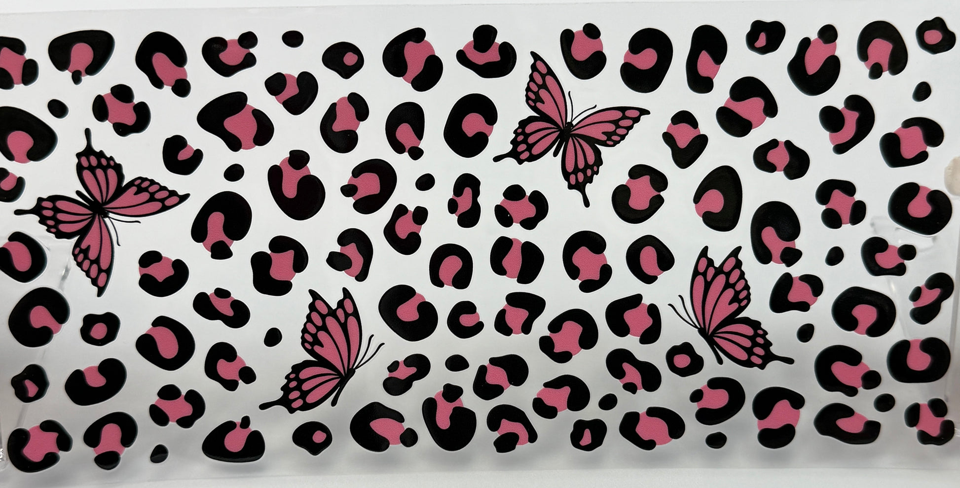 Patterned fabric with pink and black butterfly design 
