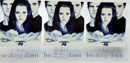 Promotional poster for 'Breaking Dawn' with characters and landscape.