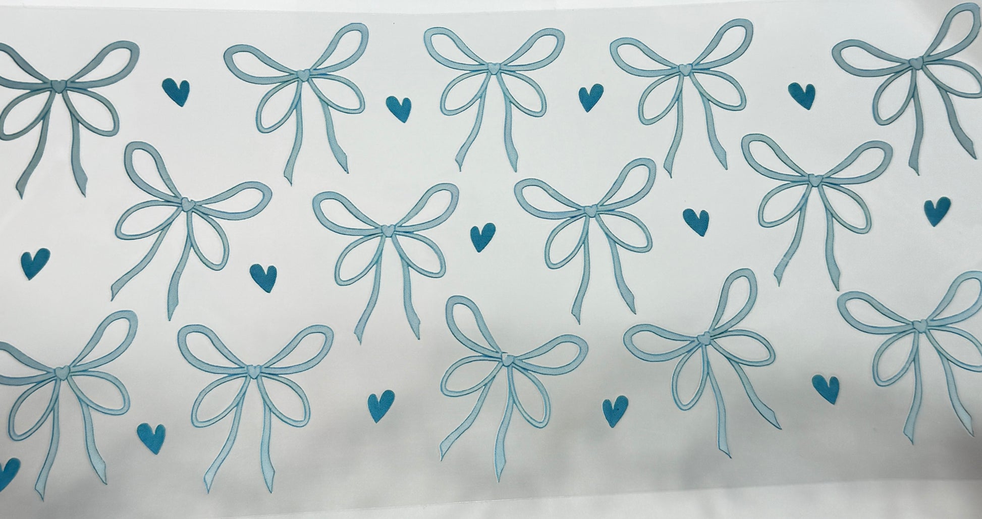 Pattern of blue bows and hearts 