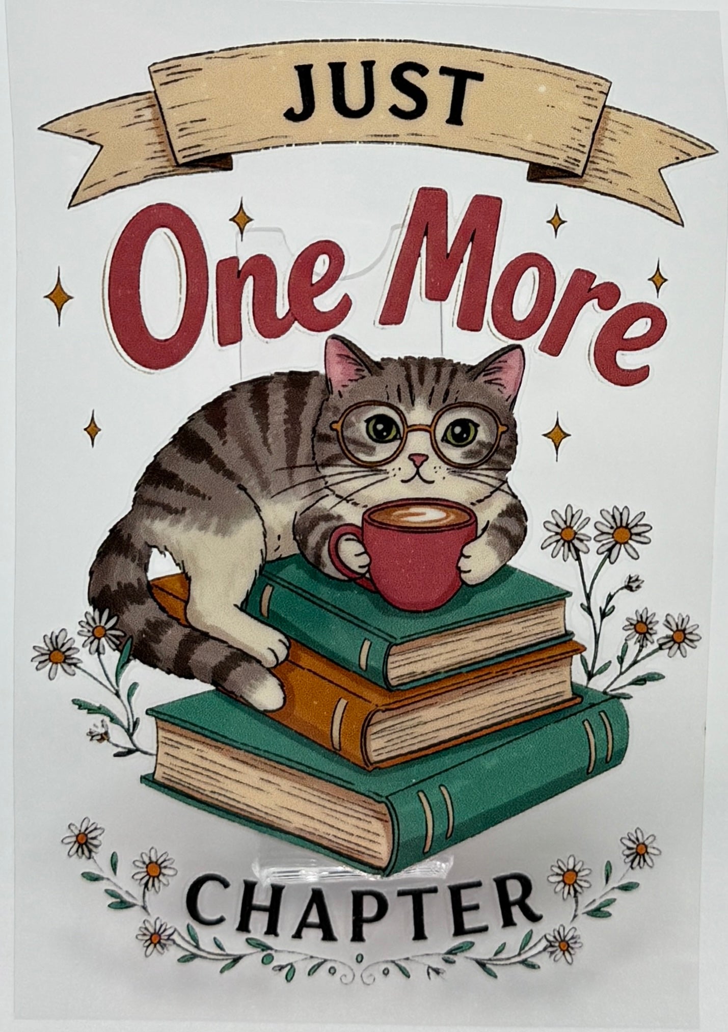 Cat with glasses reading a book with 'Just One More Chapter' text 