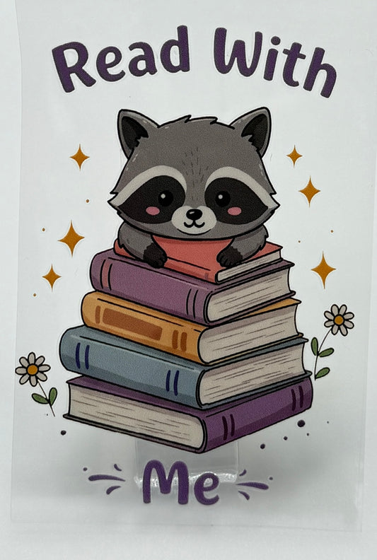 Illustration of a raccoon with books and 'Read With Me' text 