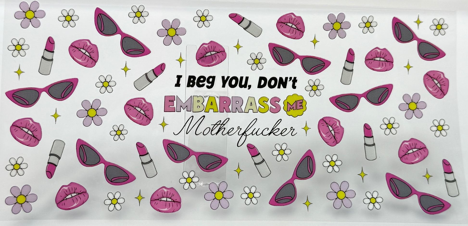 Patterned product with sunglasses, lips, and flowers 
