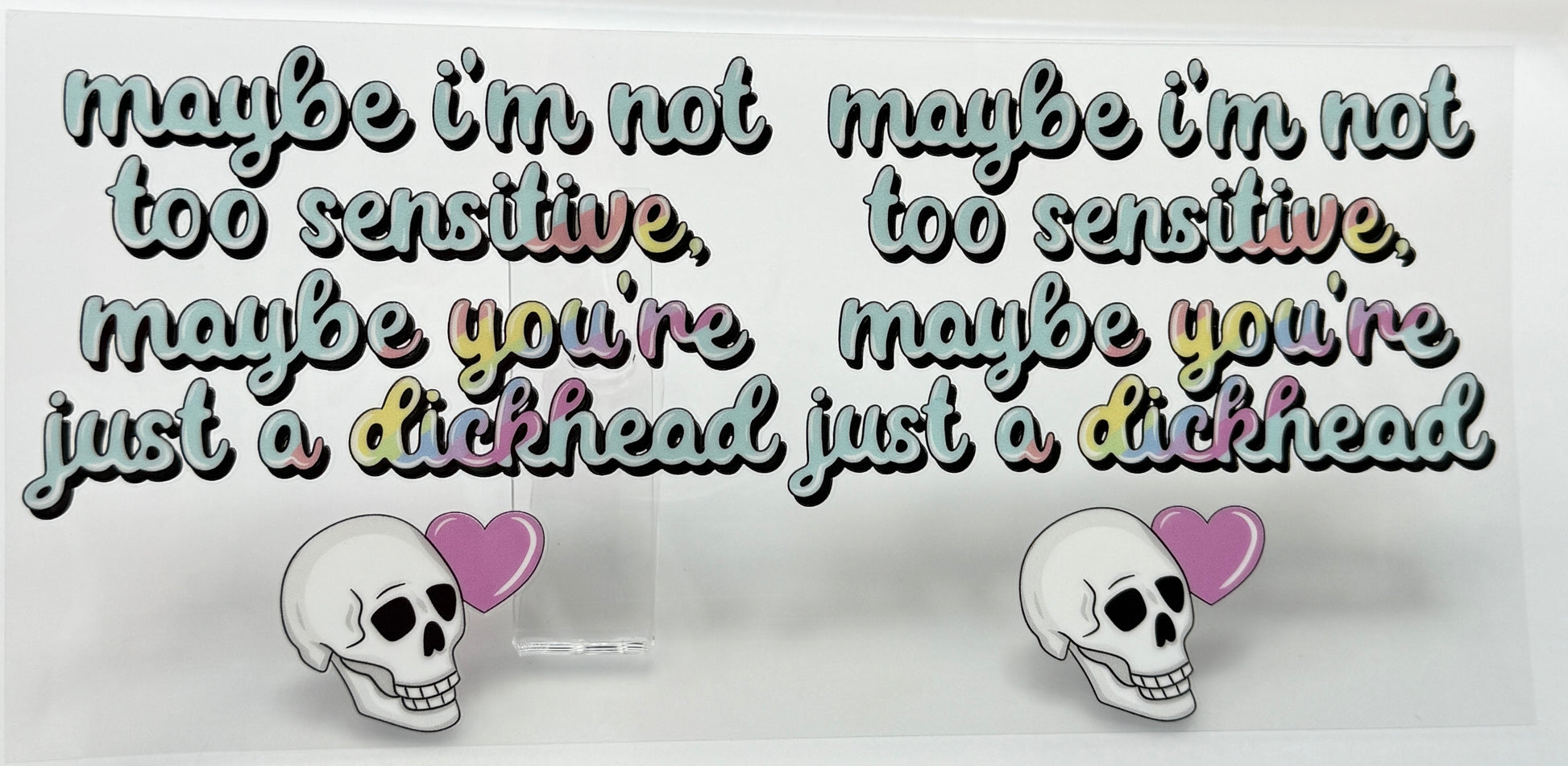 Two stickers with skull designs and text 