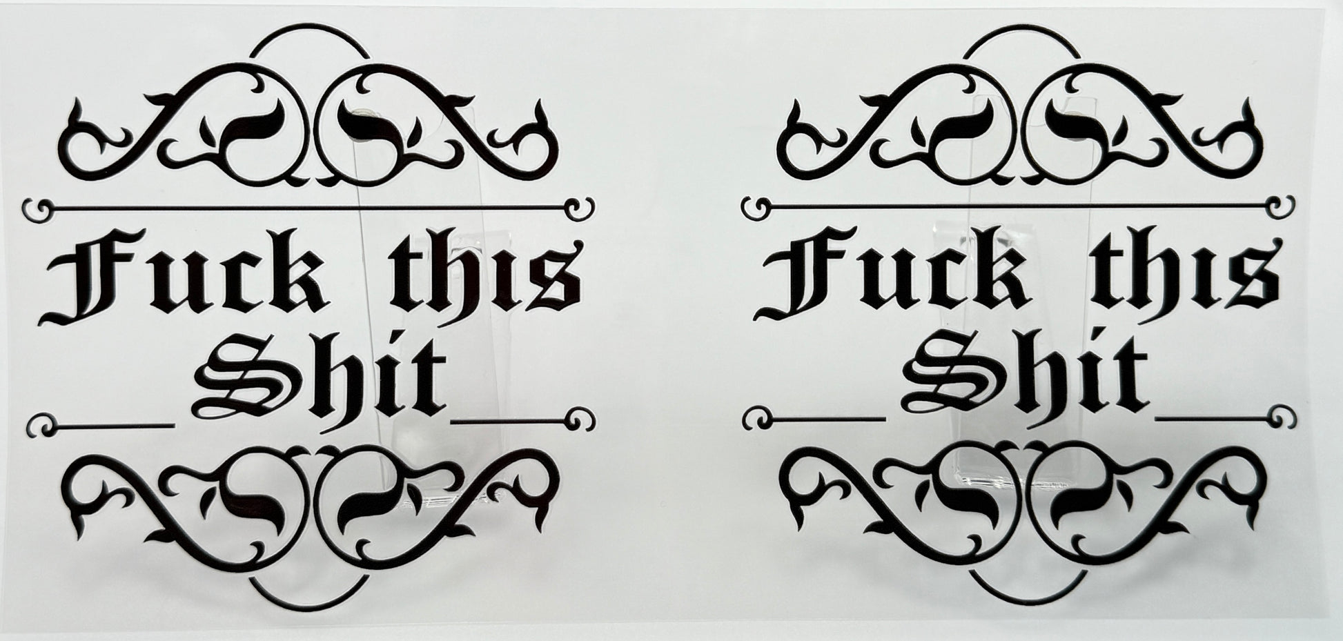 Two instances of the phrase 'Fuck this Shit' with decorative elements 