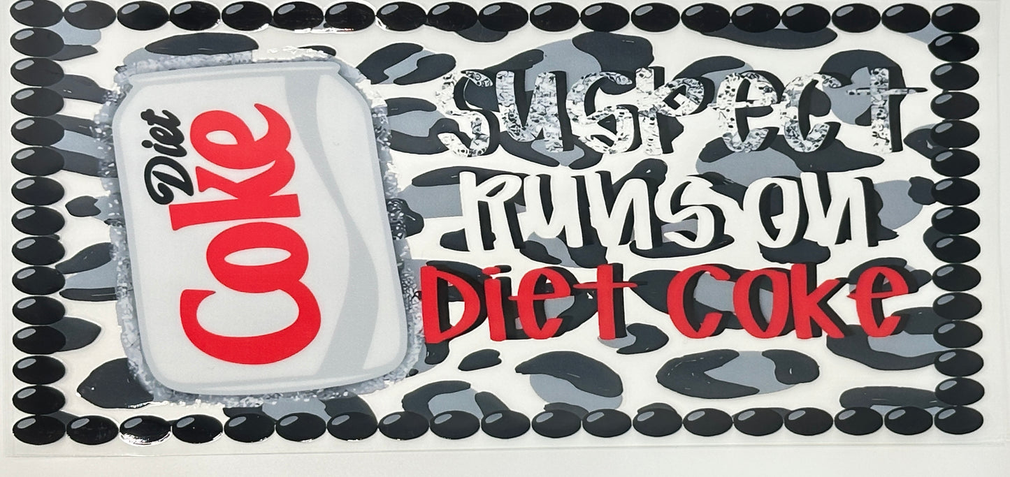 Diet Coke can with text 'Suspect runs on Diet Coke' surrounded by black and white pattern