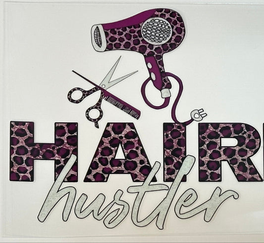 Decorative sign with hairdryers, scissors, and 'Hair Hair Hustler' text on a white background