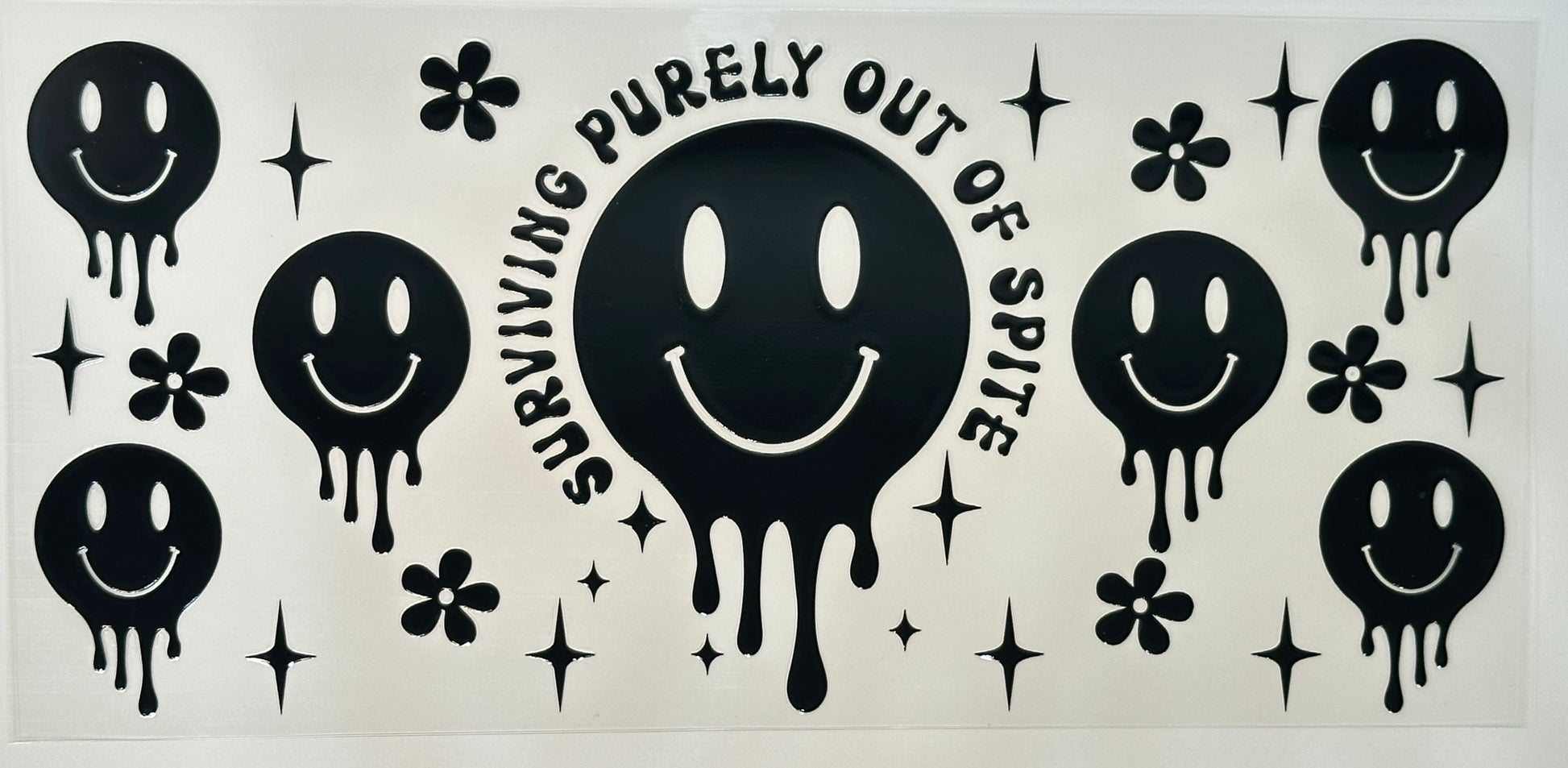Black smiley face design with text 'Surviving Purely Out of Spite' 