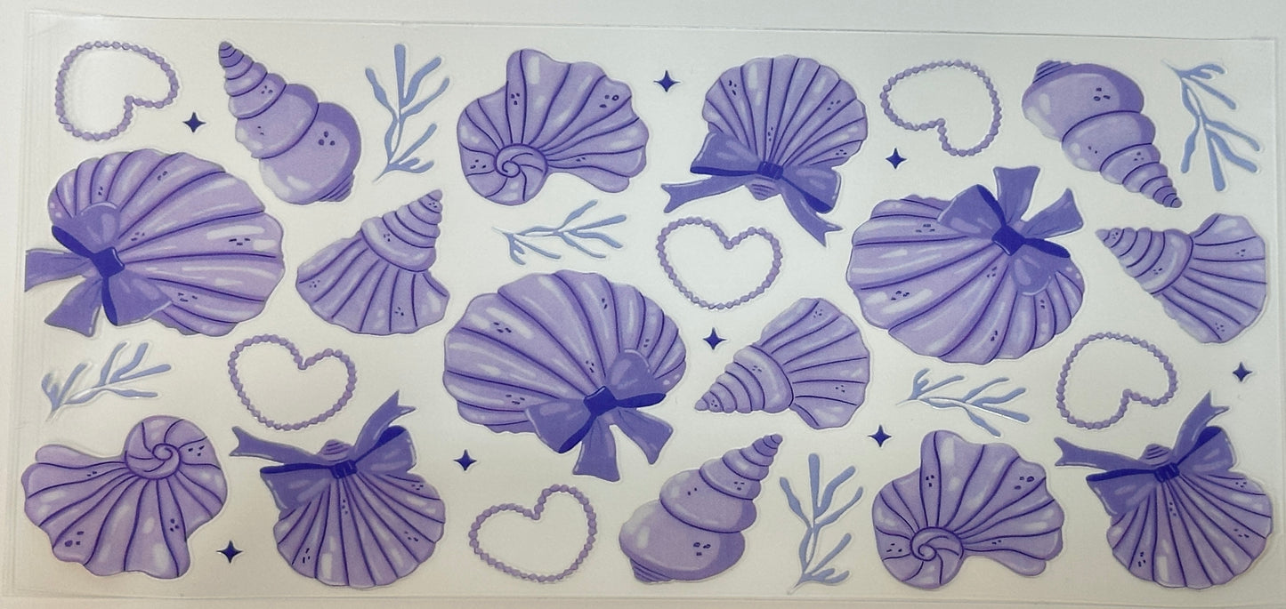 Set of purple seashell and heart designs 