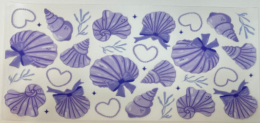 Set of purple seashell and heart designs 