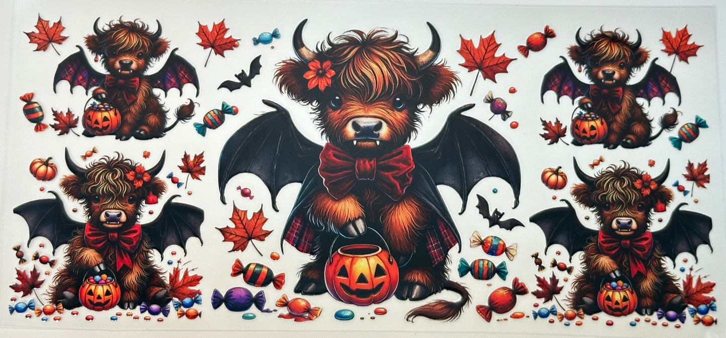 Halloween-themed illustration of a bear with bat wings, surrounded by pumpkins, candy, and autumn leaves.