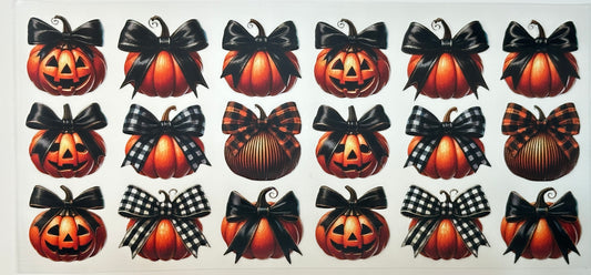 Pattern of pumpkins with black bows 