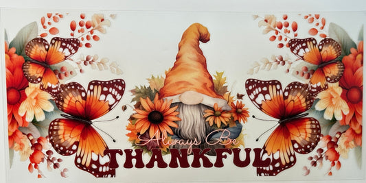 Decorative banner with butterflies, flowers, and a gnome with 'Always Be Thankful' text.