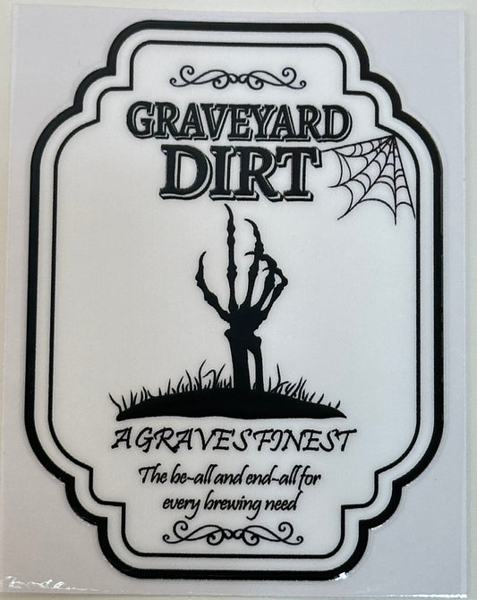 Decorative label with skeleton hand and text 'Graveyard Dirt' 