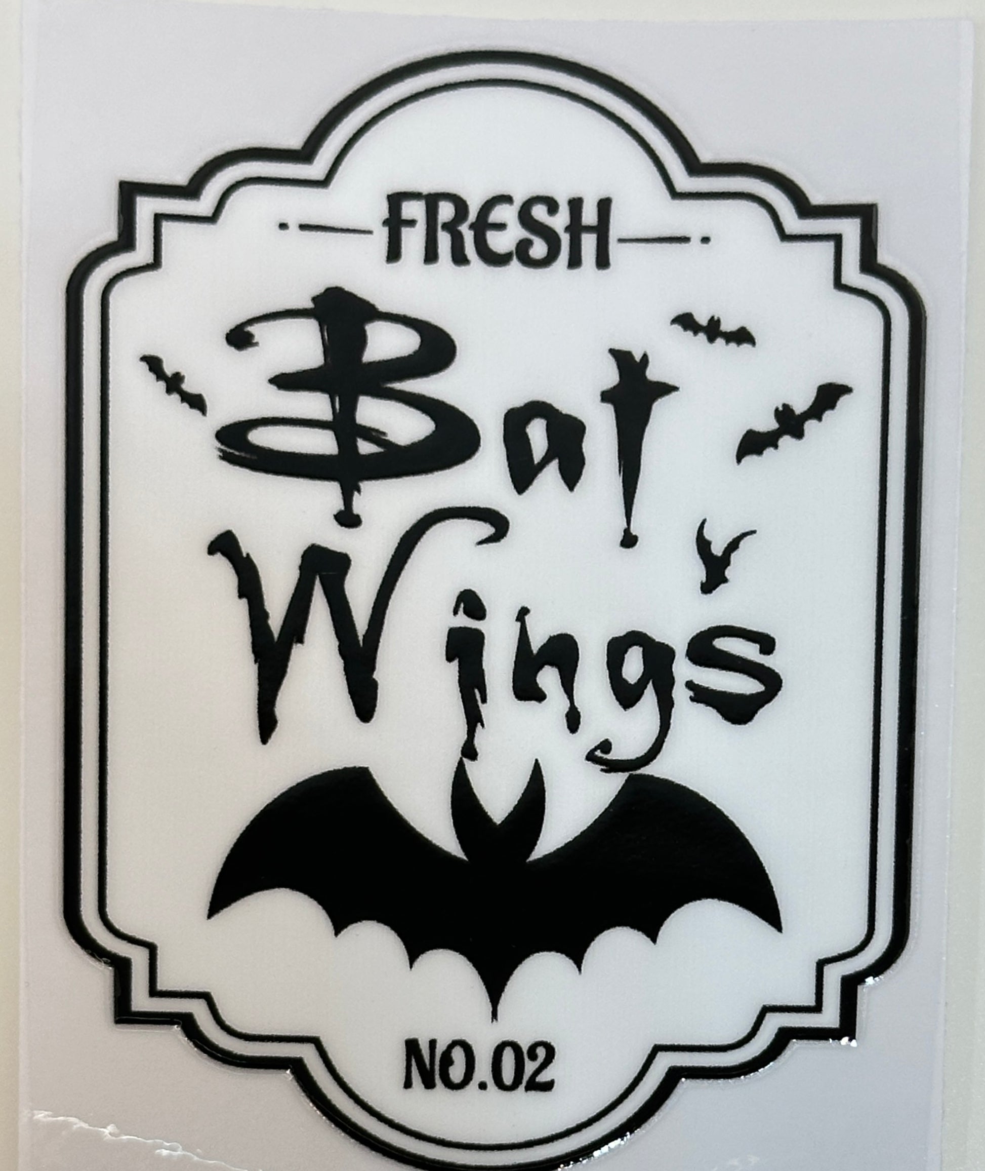 Sticker with 'Fresh Bat Wings' text and bat illustrations 