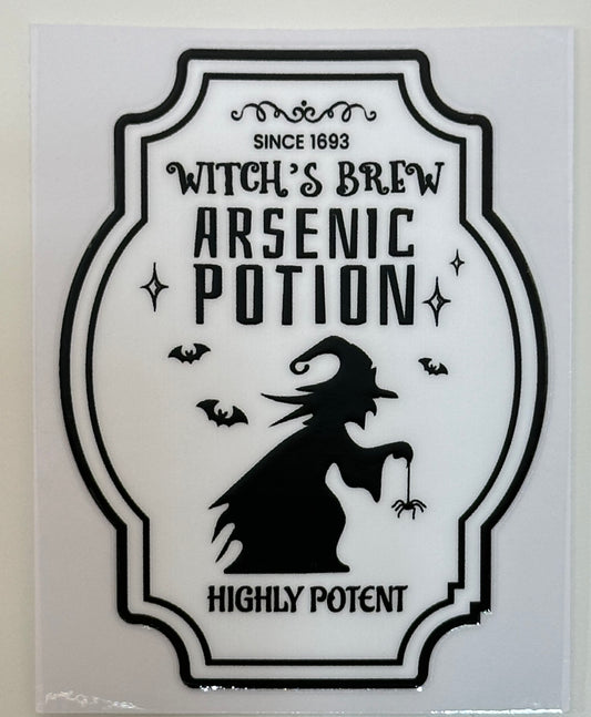 Decorative label for 'Witch's Brew Arsenic Potion' with a silhouette of a witch and text