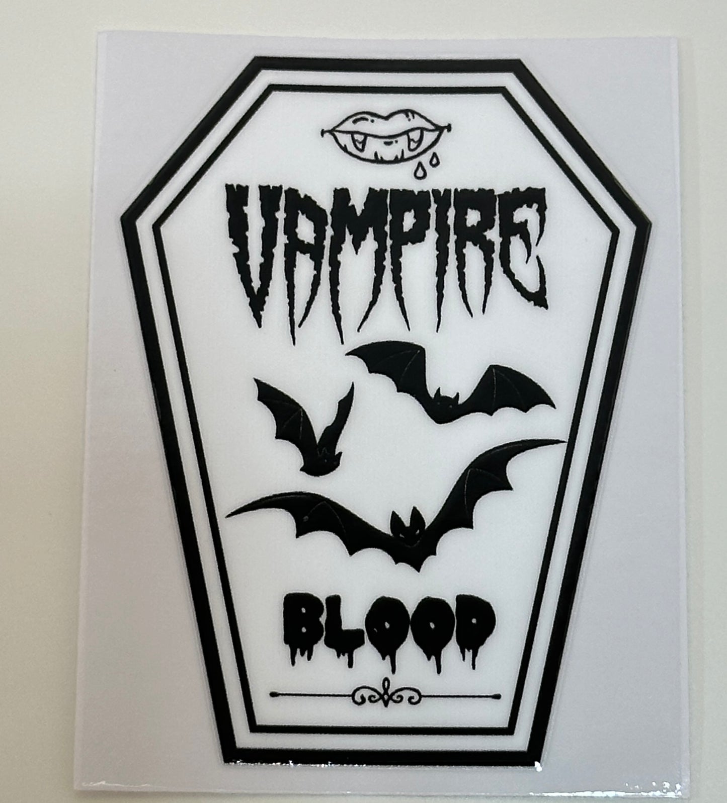 Sticker with 'Vampire Blood' text and bats 