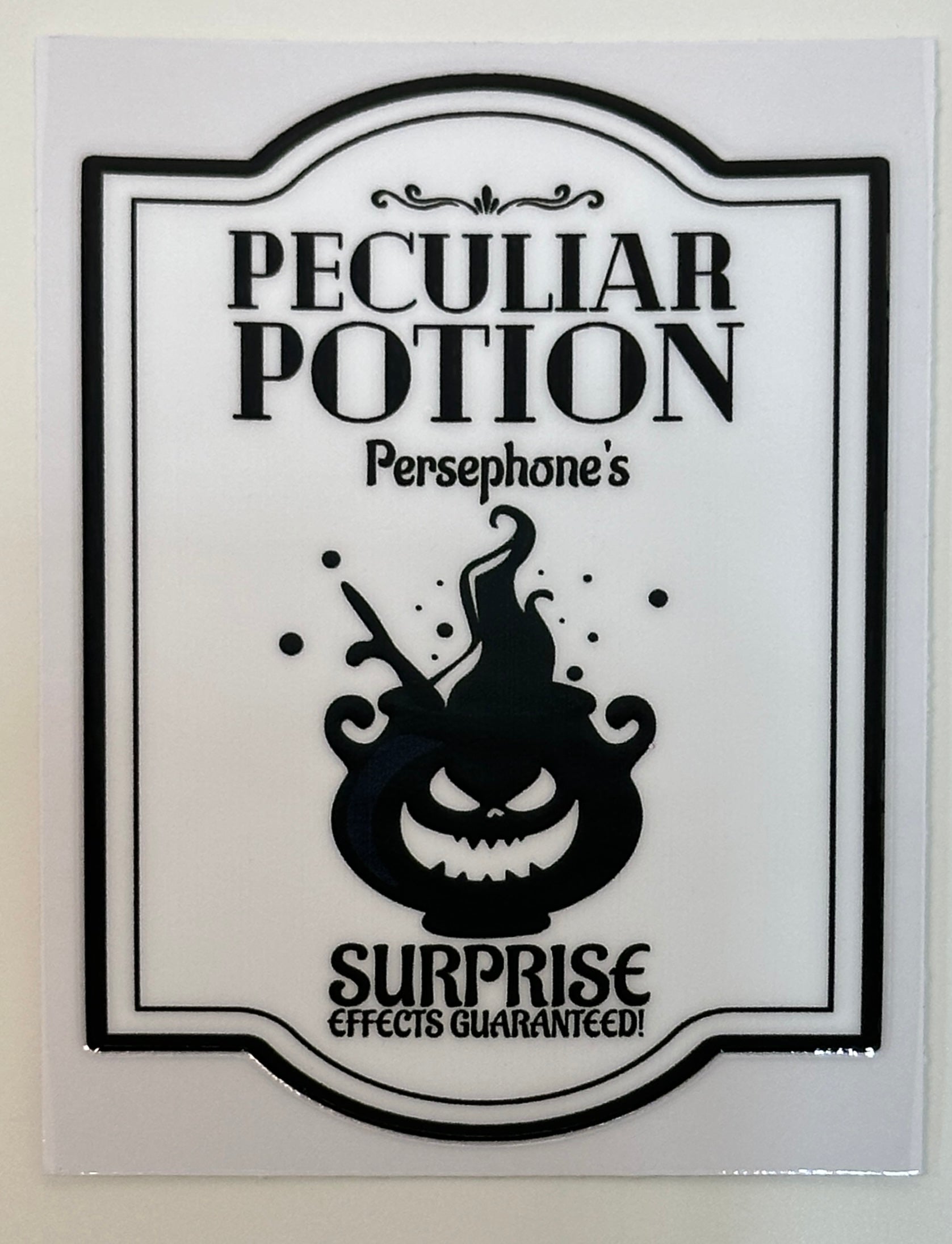 Sticker with 'Peculiar Potion' design featuring a potion bottle and text 